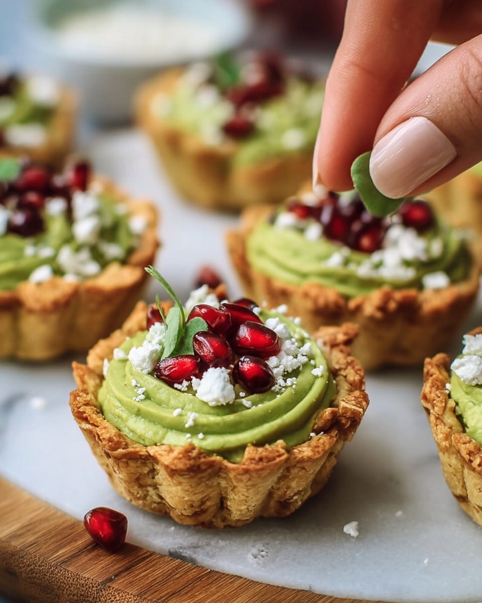Tortilla Cups with Hummus Pesto, Feta, and Pomegranate Seeds Recipe - Recipe Image